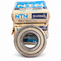 NTN 6004 ZZC3/5C NOS bearing with original NTN boxes on white background