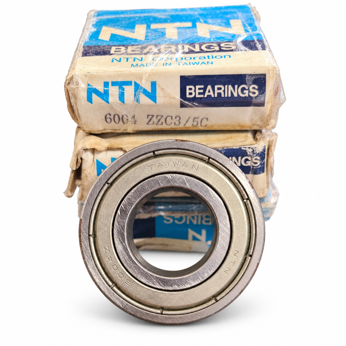 NTN 6004 ZZC3/5C NOS bearing with original NTN boxes on white background