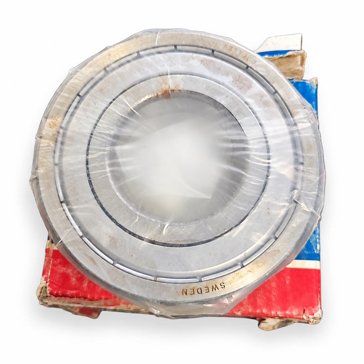 SKF bearing wrapped in plastic with box, Sweden marking, on white background